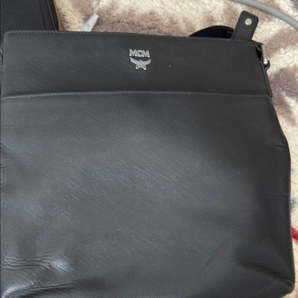 Pre loved MCM Black crossbody. This bag can be unisex. Good condition.